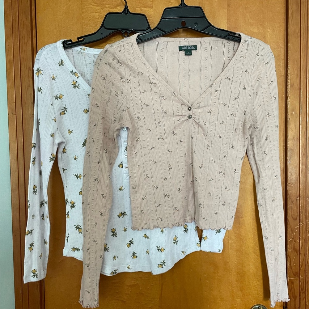 Two cropped floral shirts